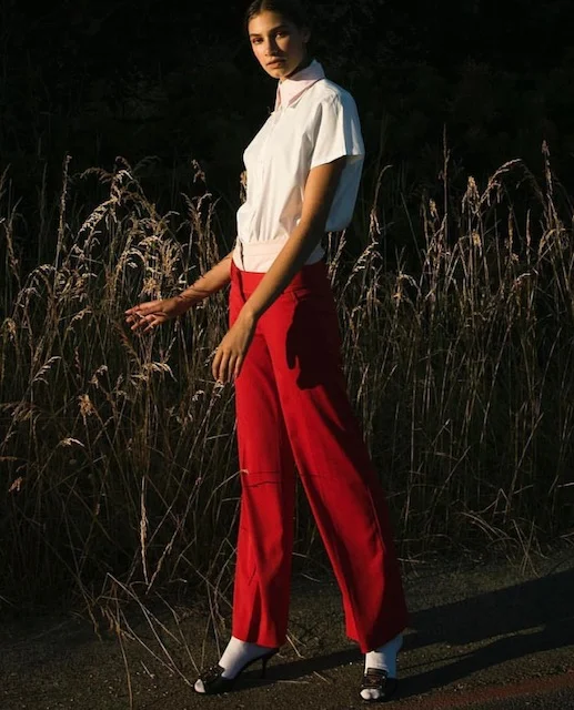 Modal wears a white top & red flare pant and pick VCI Artists for hair & makeup