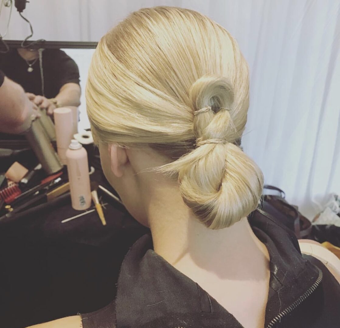 VCI Artists makes beautiful hair buns on a model