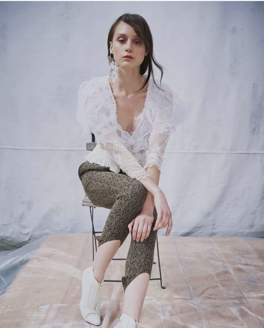 Women choose VCI Artists for makeup & wear a Vintage white sheer floral Blouse and snakeskin print pant