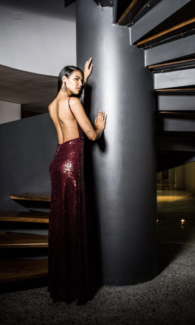 The model is wearing a Backless Sequin Full-length Dress styled by Wardrobe stylist Summer Salah of VCI Artists